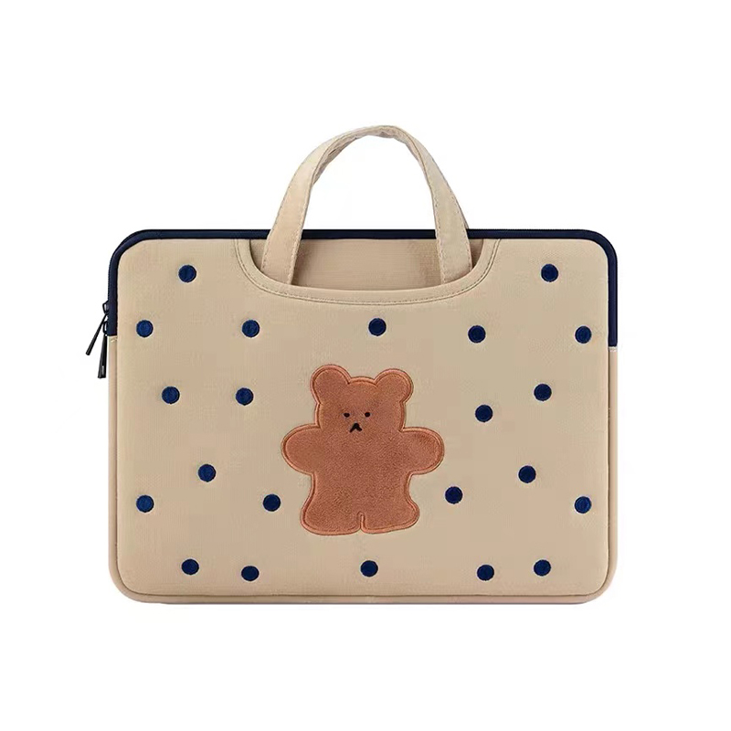 How can a polka dot bear embroidered handbag add interest and distinction to commuter outfits?