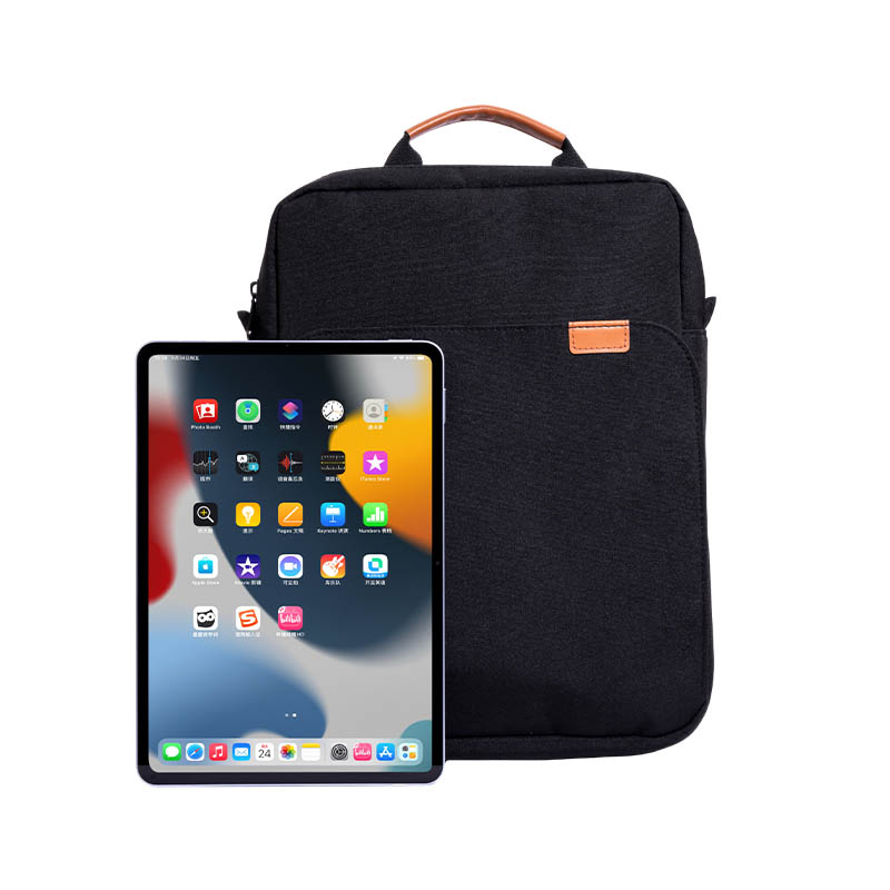 How is the carrying system of a laptop handbag designed to reduce the burden of carrying it for extended periods?